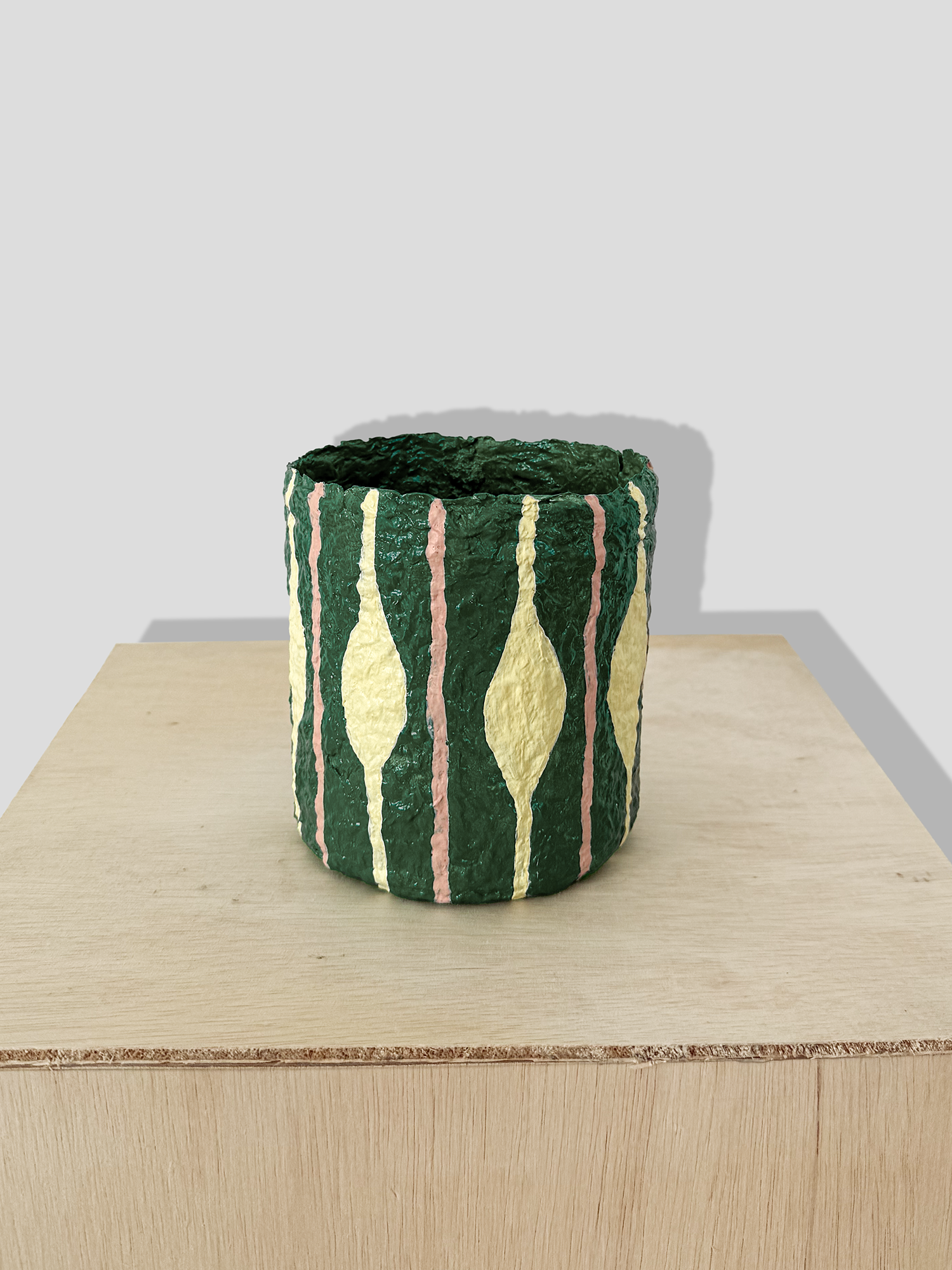 Papier mâché small vase with irregular stripes