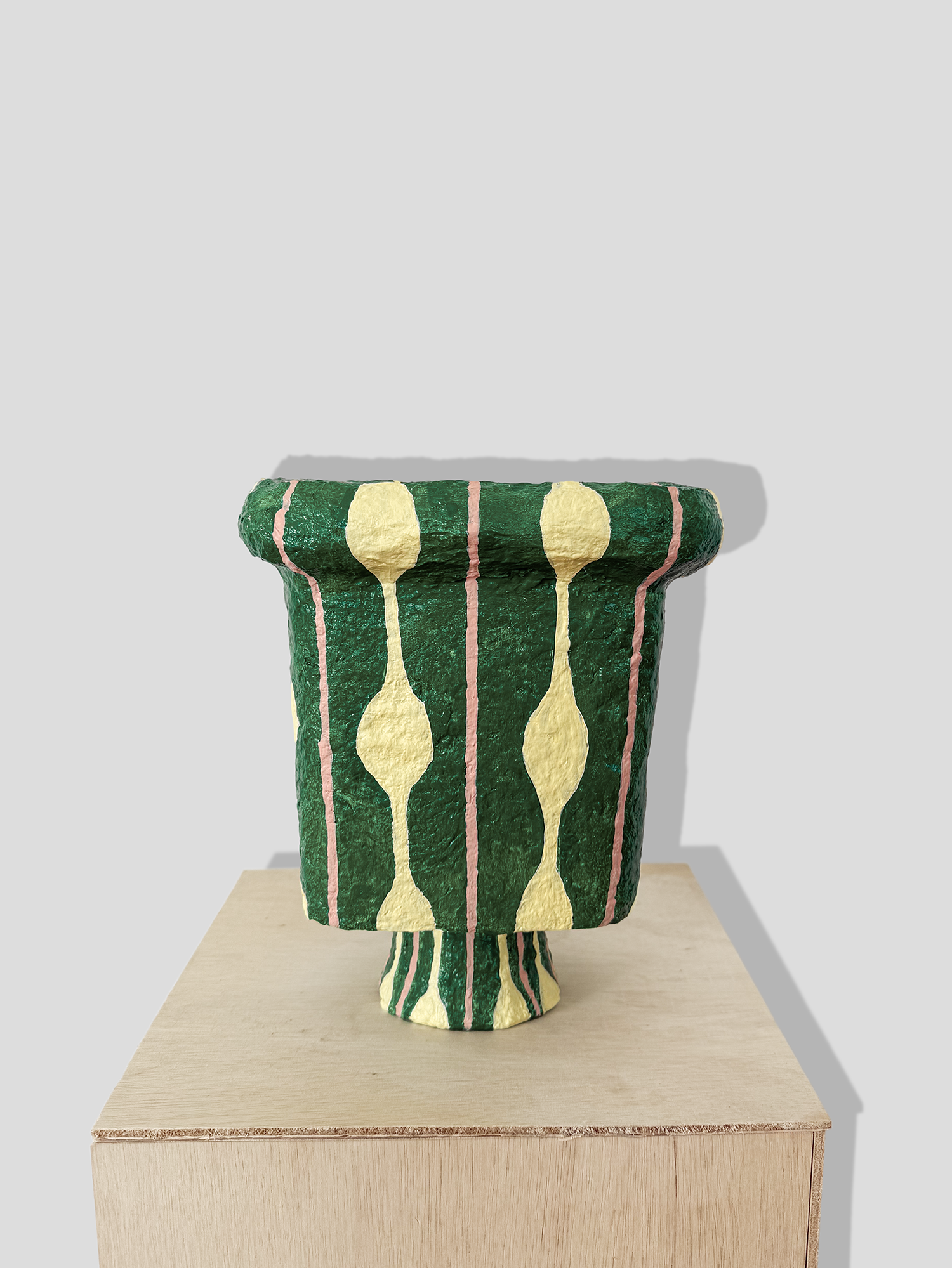 Papier mâché urn with stand and irregular edge