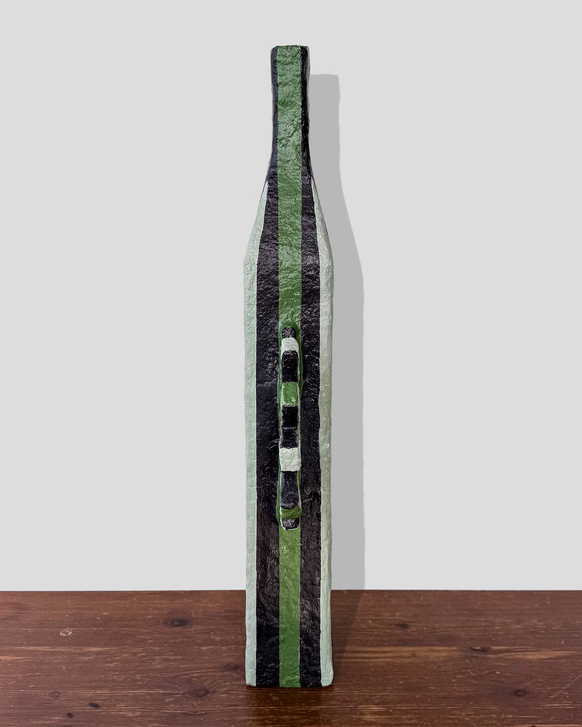A hand-painted paper pulp vase with geometric pattern created by artist Meritxell Claverol