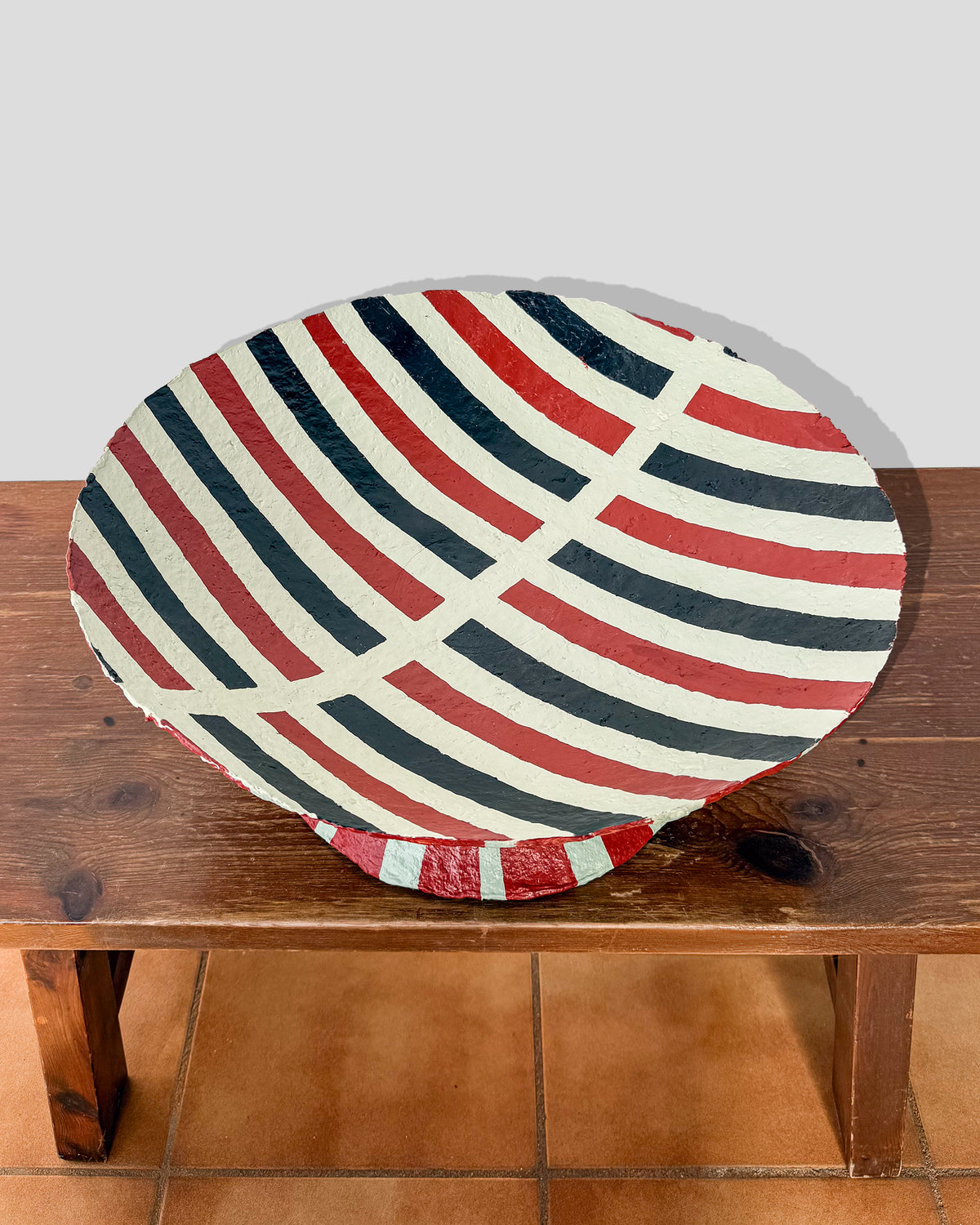 A hand-painted paper pulp vase with geometric pattern created by artist Meritxell Claverol
