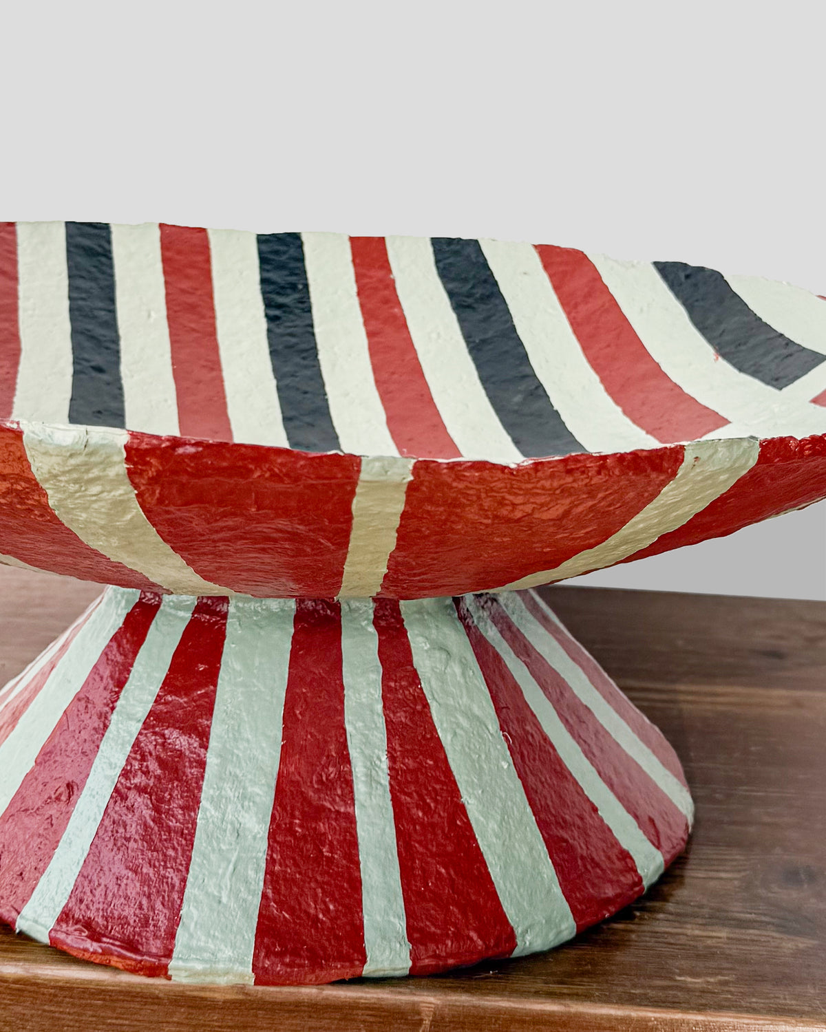 A hand-painted paper pulp vase with geometric pattern created by artist Meritxell Claverol