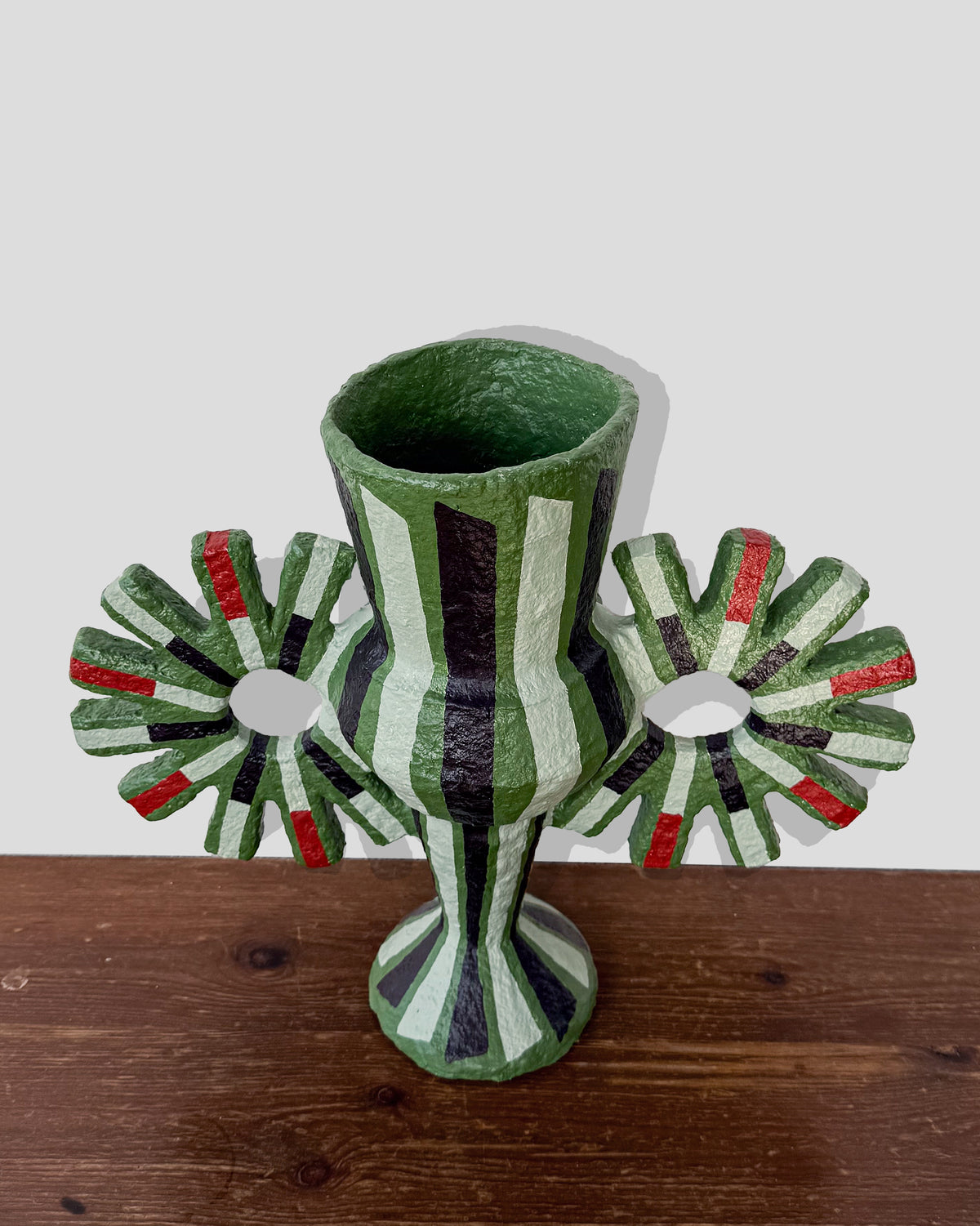 A hand-painted paper pulp vase with geometric pattern created by artist Meritxell Claverol