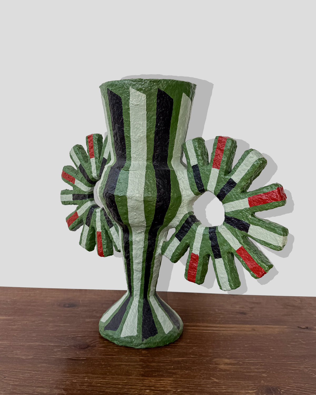 A hand-painted paper pulp vase with geometric pattern created by artist Meritxell Claverol