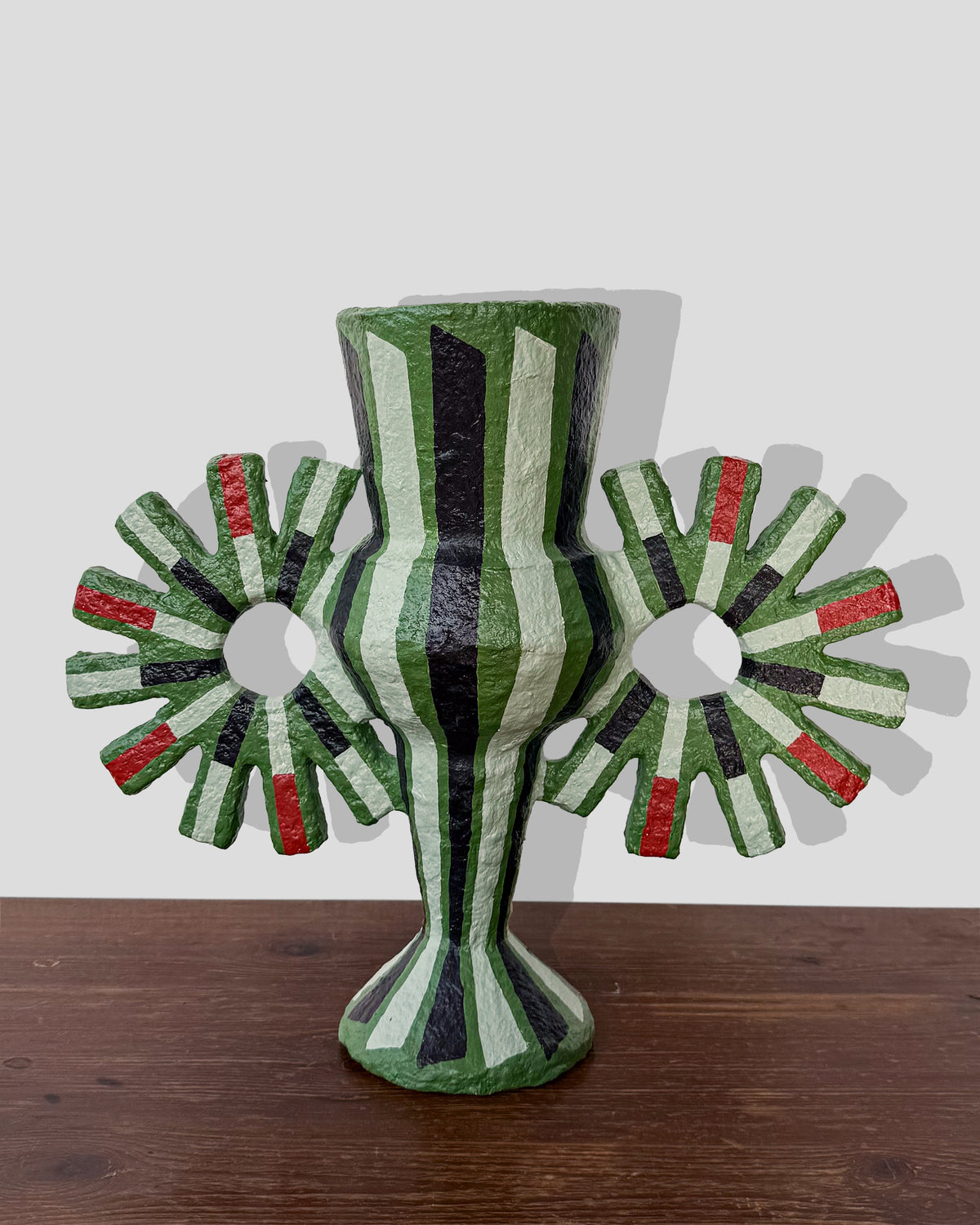 A hand-painted paper pulp vase with geometric pattern created by artist Meritxell Claverol