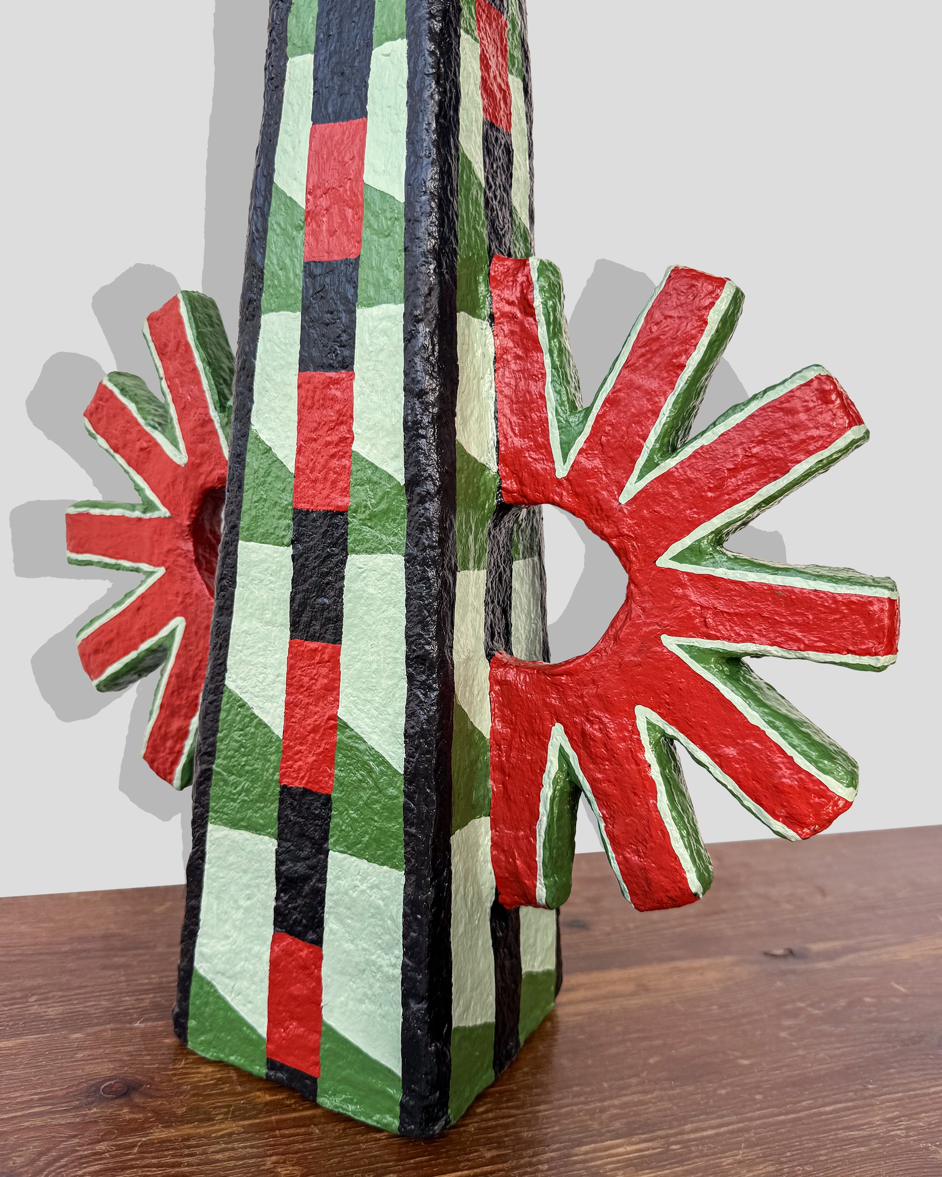 A hand-painted paper pulp vase with geometric pattern created by artist Meritxell Claverol