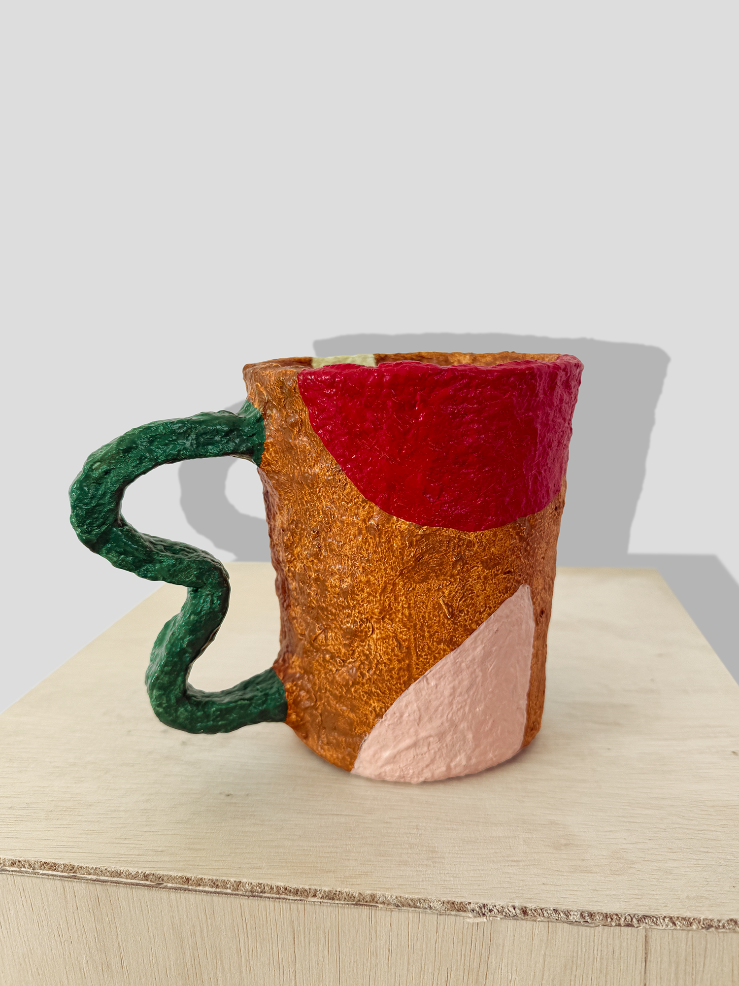 Papier mâché small vase with irregular handle